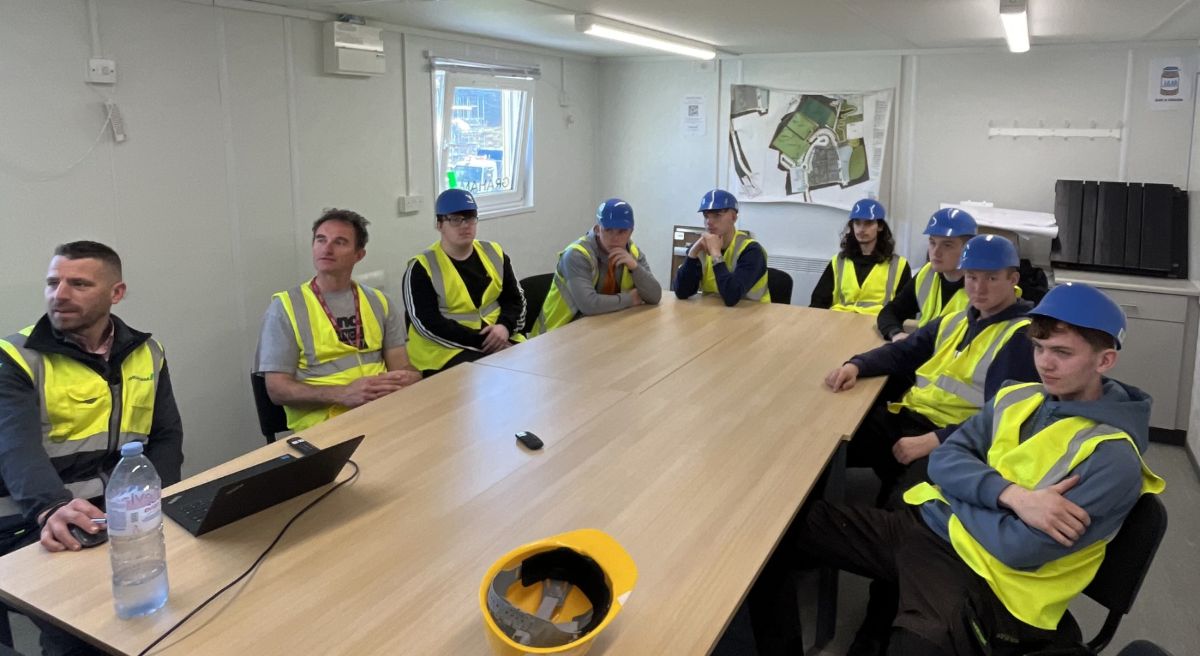 Students engage in Health and Safety Session before tour of the site.