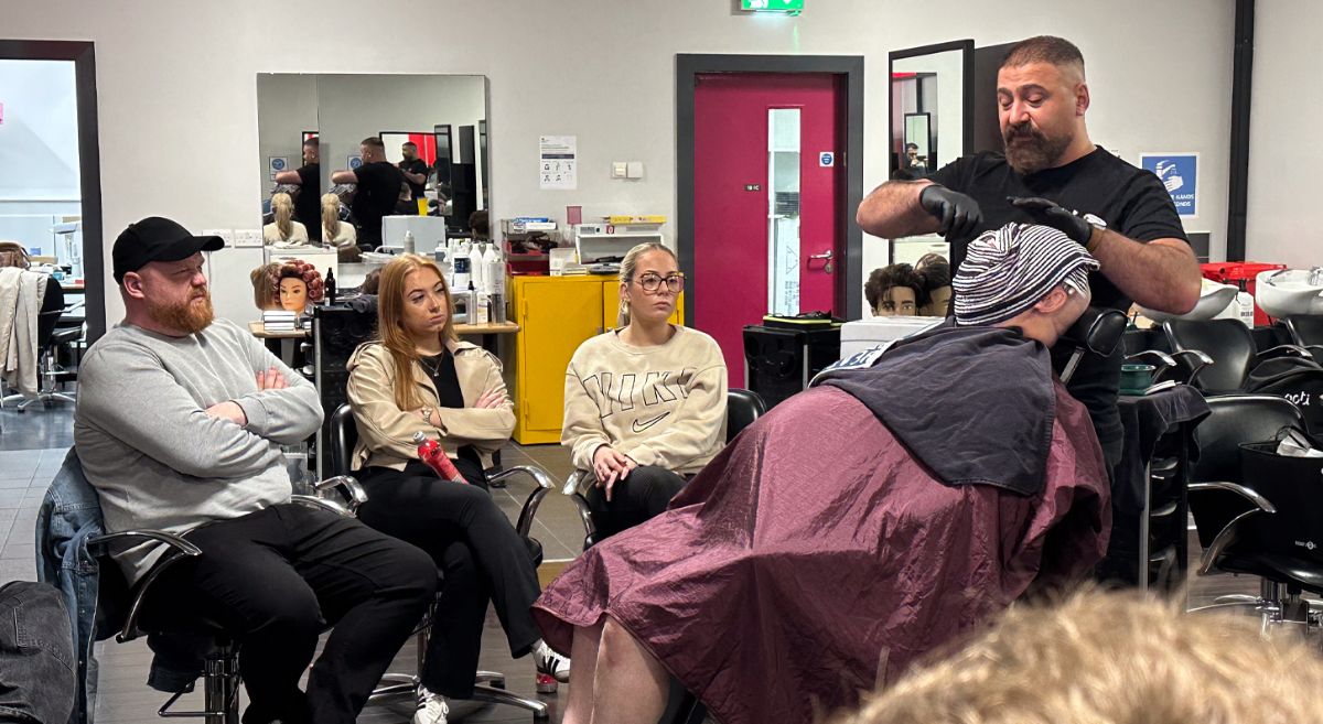 Picture of SERC Barbering students watching a shaving demo