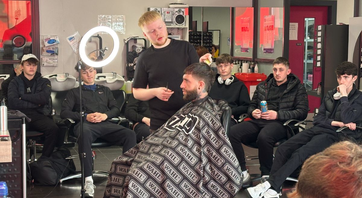 Picture of SERC Barbering students watching a hair cut demo