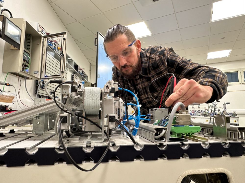 Ryan Boyd working on advanced equipment in a SERC workshop