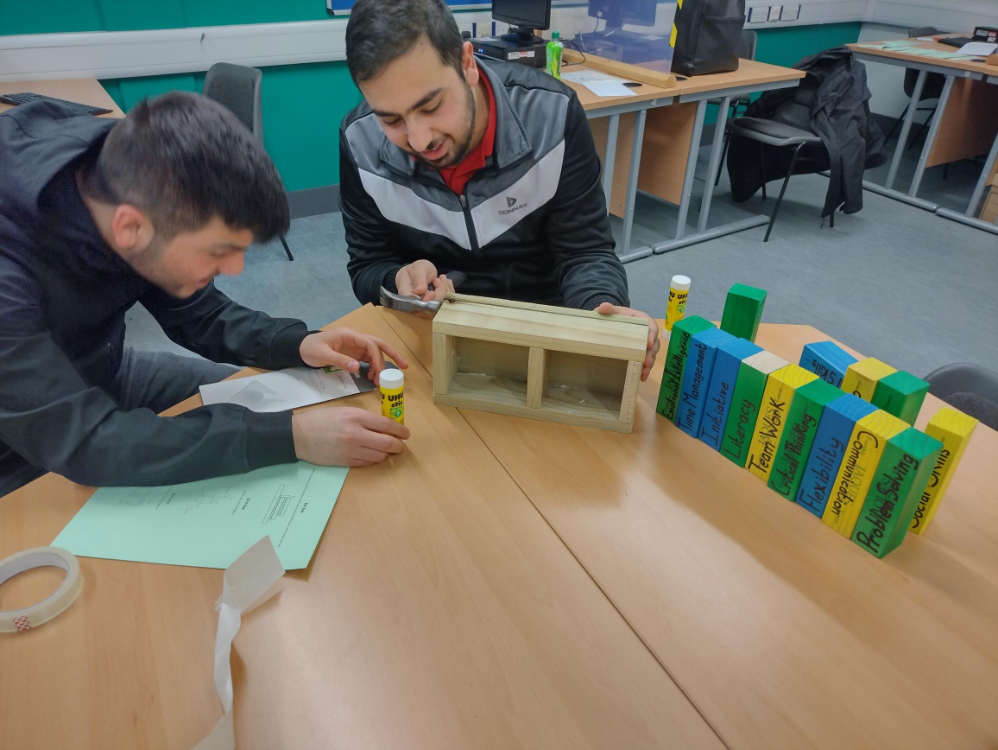 two students assembling bird box