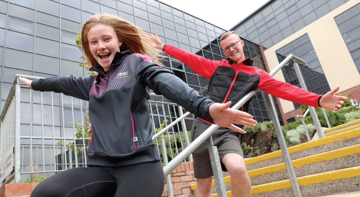 Image showing happy students cheering outside