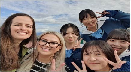 Natasha and Charlotte with students at (Toyama Minami High School