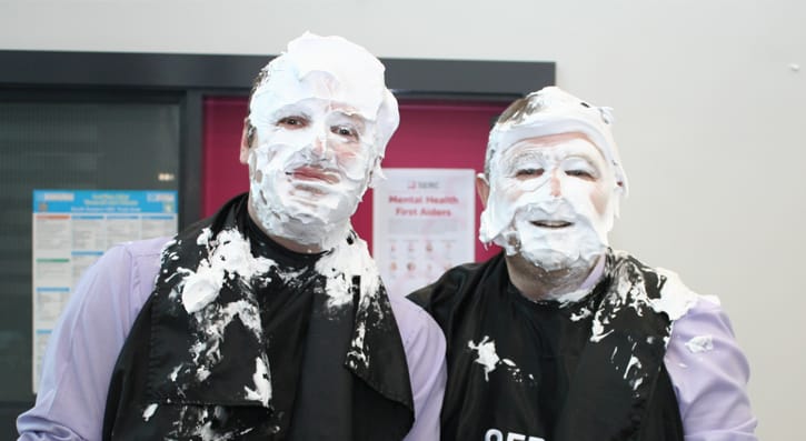 Members of the college management get involved in the pie face event