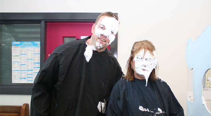 Members of the college management get involved in the pie face event