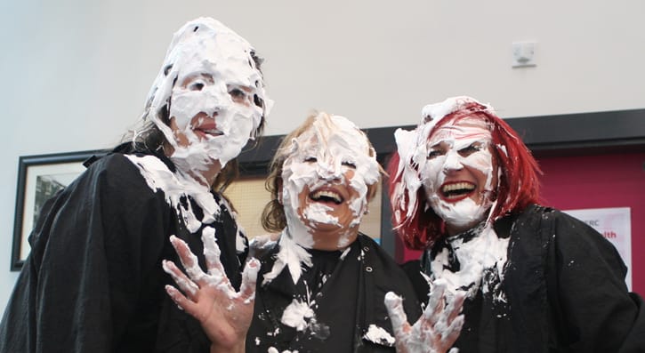 Members of the college management get involved in the pie face event