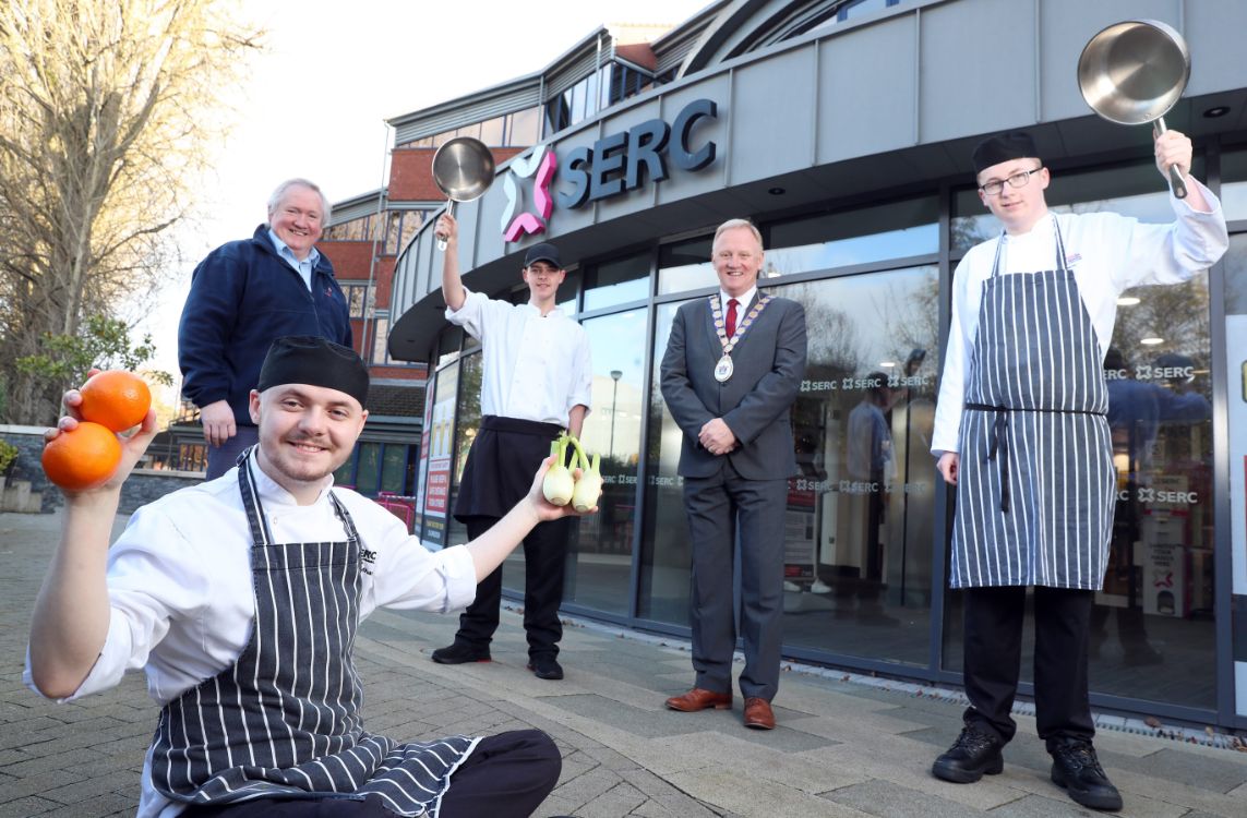 Bangor Campus NVQ Level 3 Professional Cookery students Jack Rossbotham (Bangor), Sam McGorman (Newtownards) and Cameron Barclay (Donaghadee) with Ken Scott , Bangor Foodbank & Community Support and Mayor of Ards and North Down, Councillor Trevor Cummings.