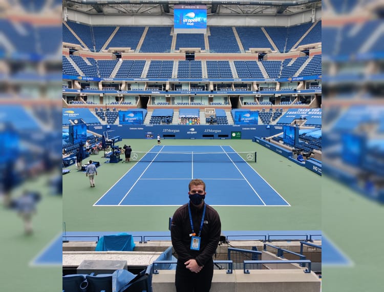 philip standing near the us open tennis court