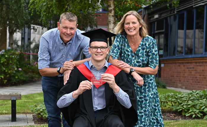 Peter Davison, from Saintfield, graduated with a HND in Engineering celebrates with proud parents Robert and Denise