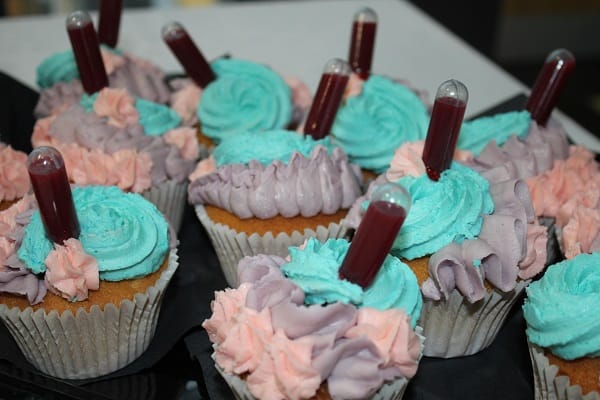 Lemon Cupcakes with a raspberry pipette.