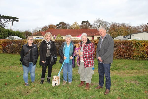 Guests with pet dogs pictured in the garden,