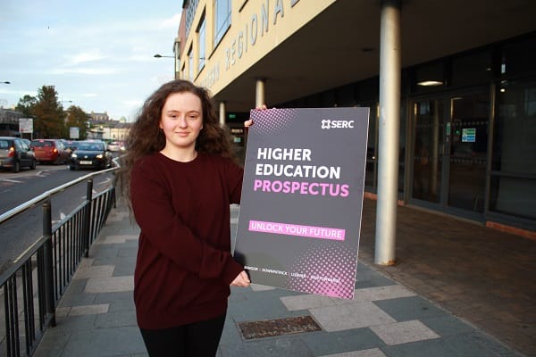 Setanta Gorman-Crane from Downpatrick is studying on the Ulster University Foundation Degree course in Computing at Downpatrick Campus pictured with prospectus cover promotion board.