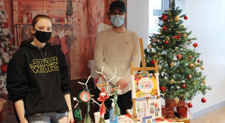 Students behind their stall at the Christmas fairs in Downpatrick