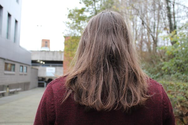 Photo of  Rudi's hair from the back showing hair below shoulders.