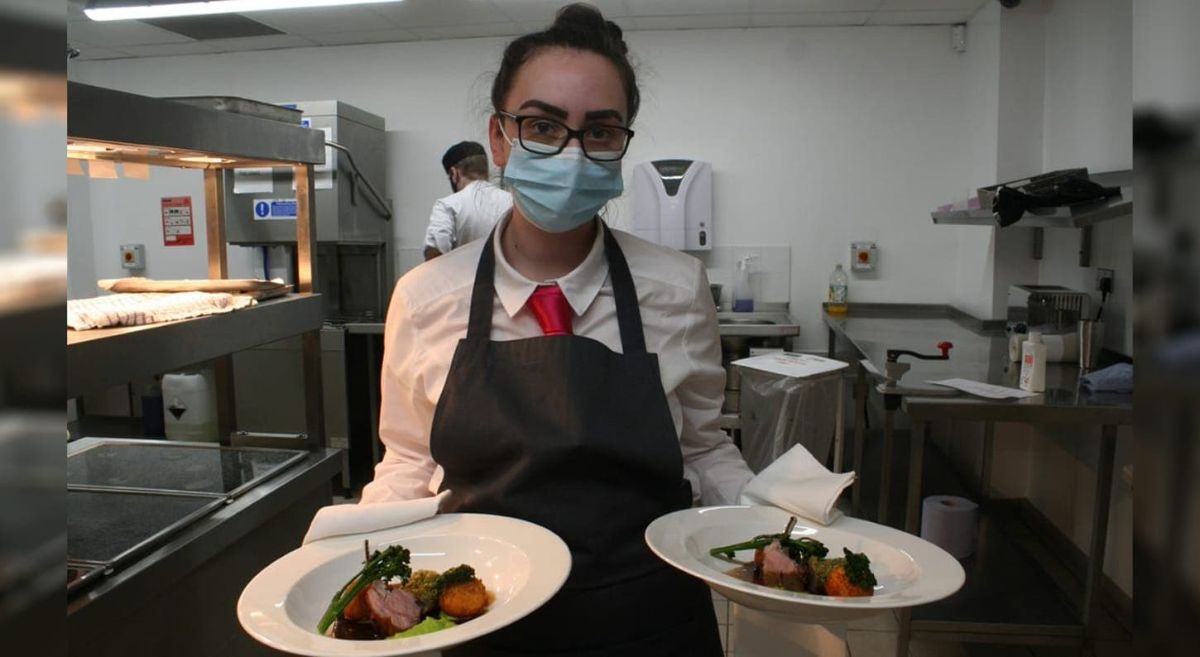 Student serving food