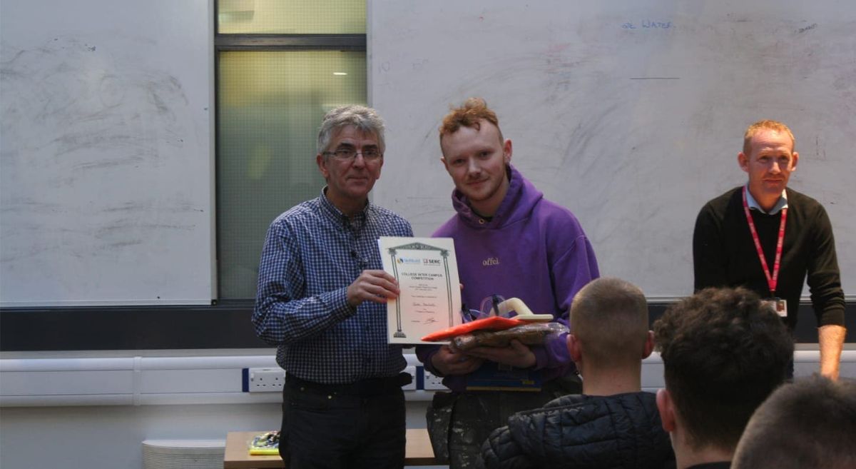 Lisburn Plastering: Jake Beckett collects his award for finishing first in the competition. 