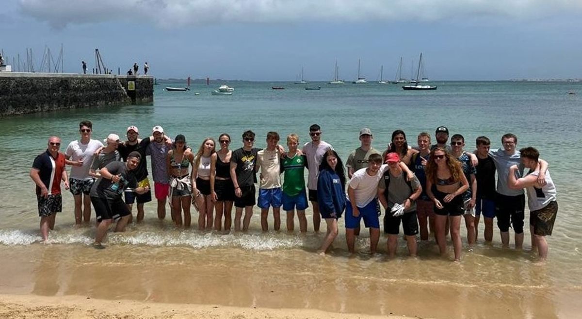 Sports students paddling in the sea