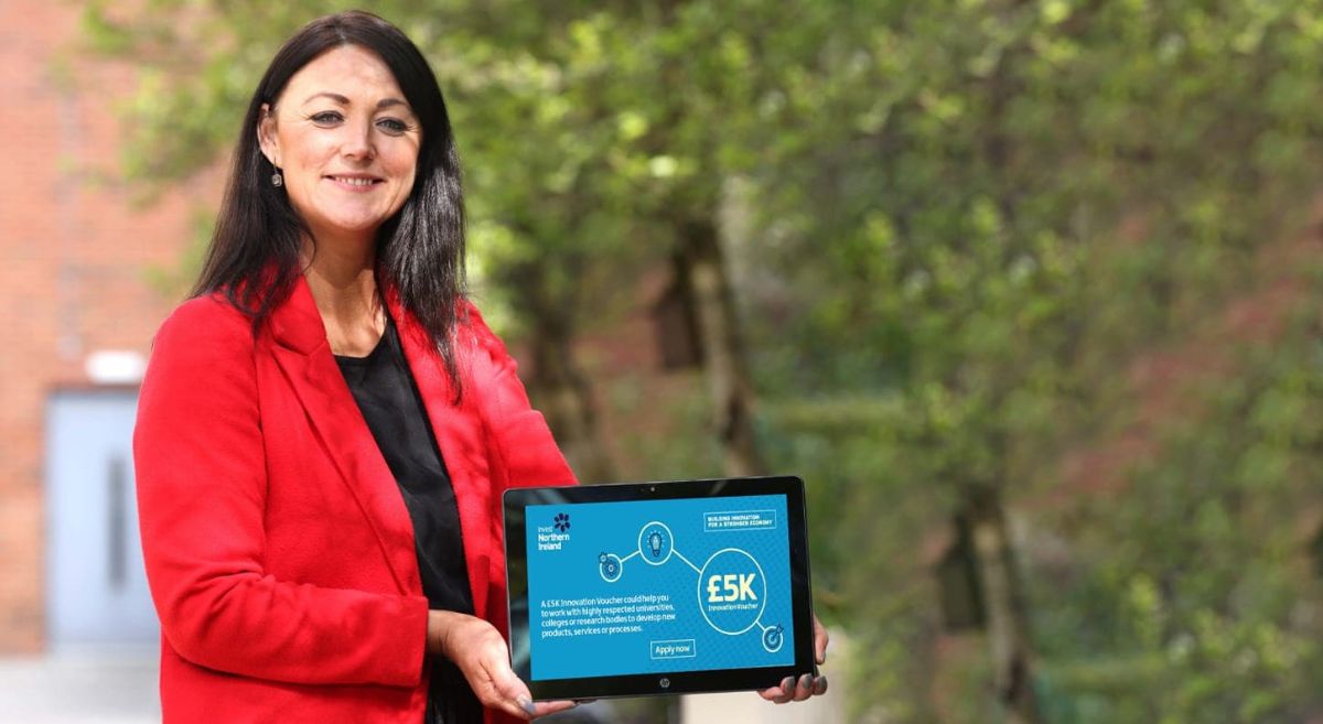 Elaine Flynn Holding Tablet with Call for Innovation Voucher