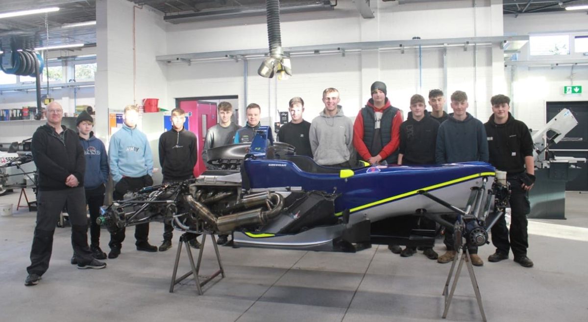 Formula 3 car with students