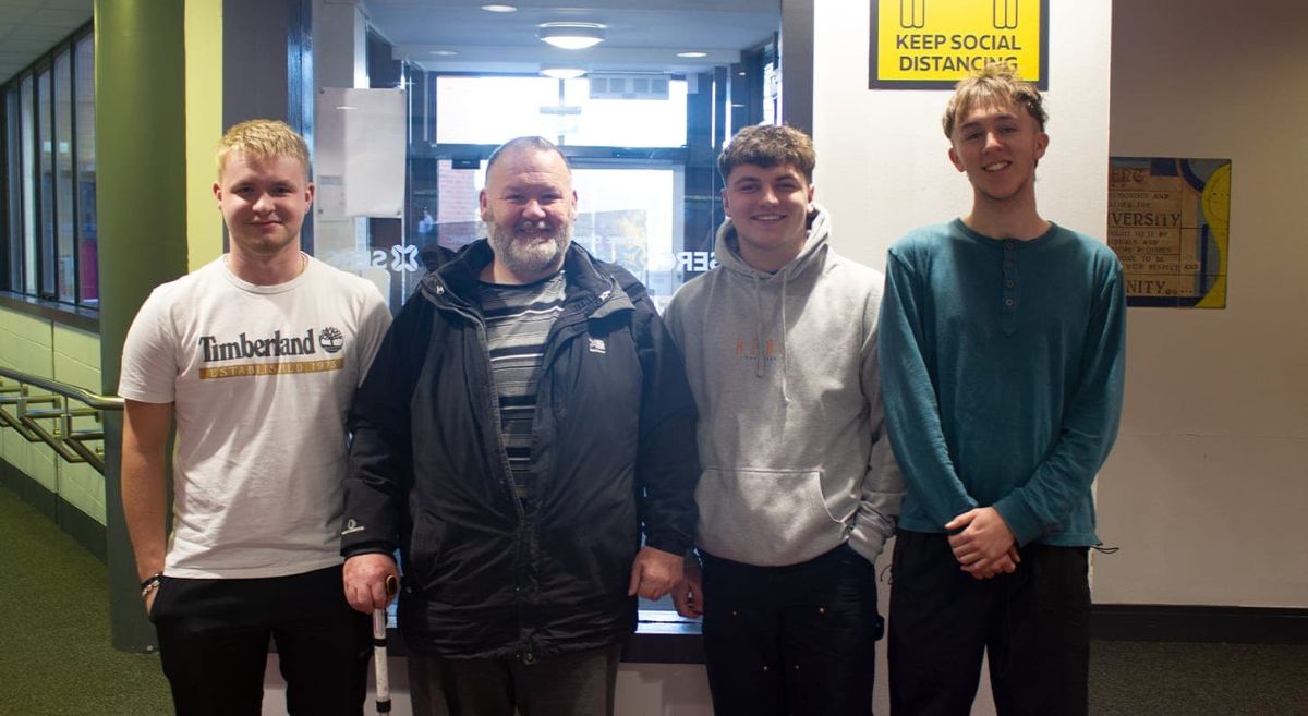 Bangor NVQ Level 2 Barbering students Jonny Murray, with Stephen Strong, RNIB, Sam Gordon and Harry Creighton.