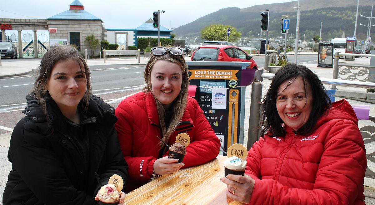 Animal Care students and lecturer enjoy an icecream with Mourne Mountains and sea in background