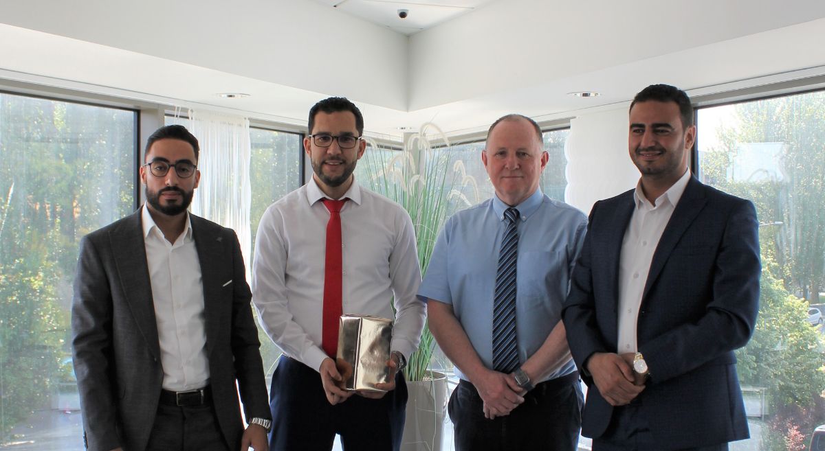 Visitors from the Institute of Renewable Energy & Energy Efficiency Training in Morocco are presented with a gift