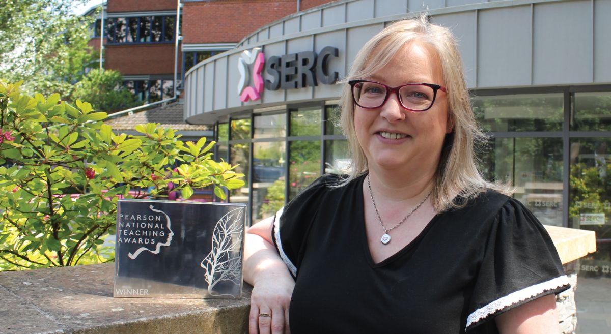 Picture of Aine McGreeghan and trophy outside SERC Bangor Campus 