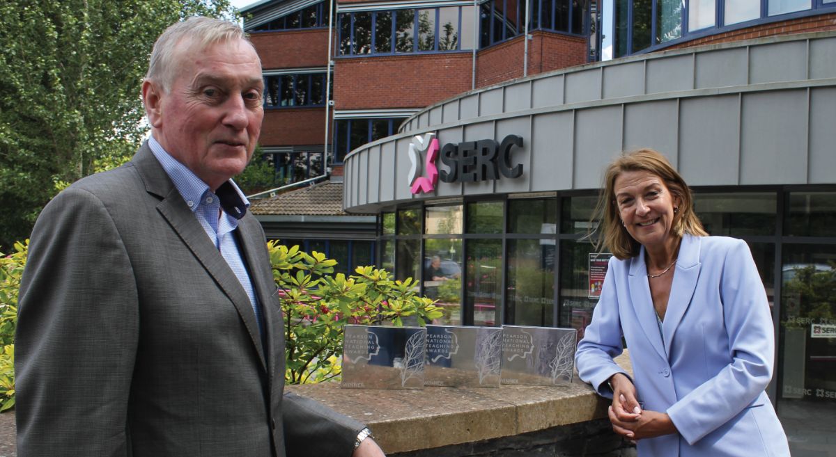 Picture of Ken Webb and Jane Baker with trophies outside SERC Bangor Campus 