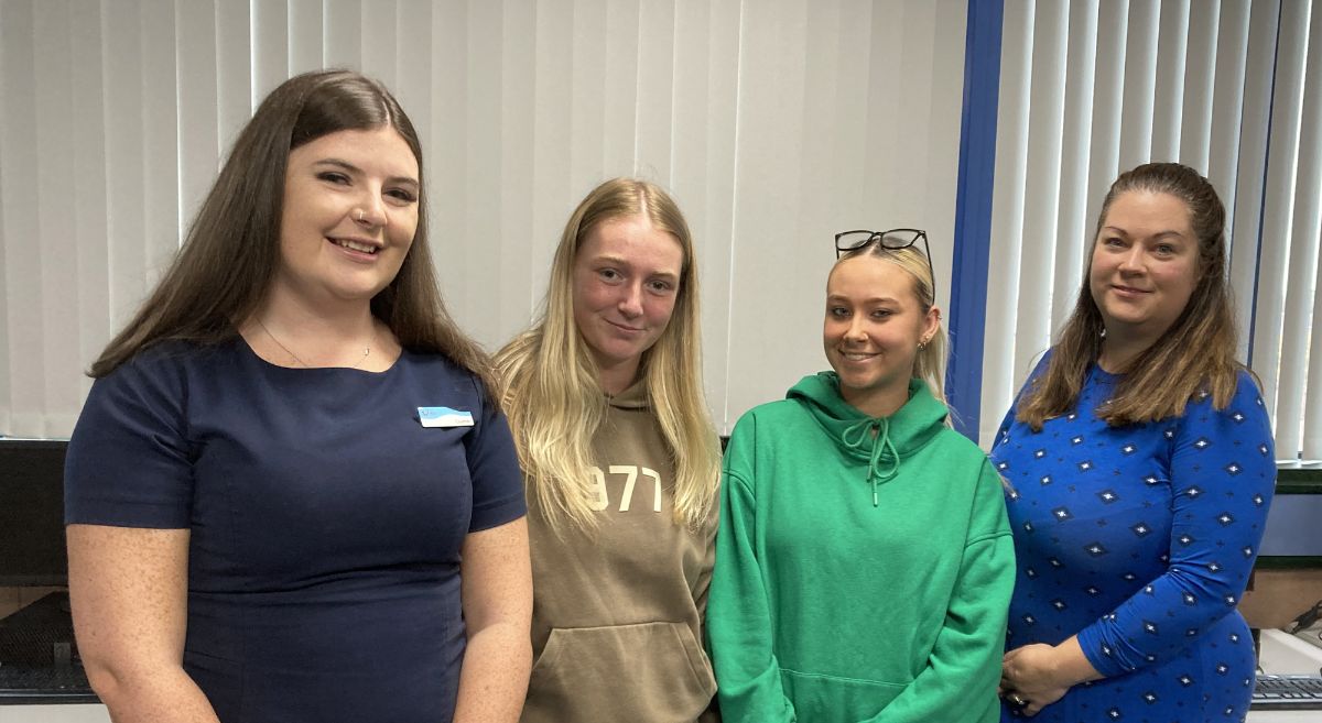 Four females in class room 