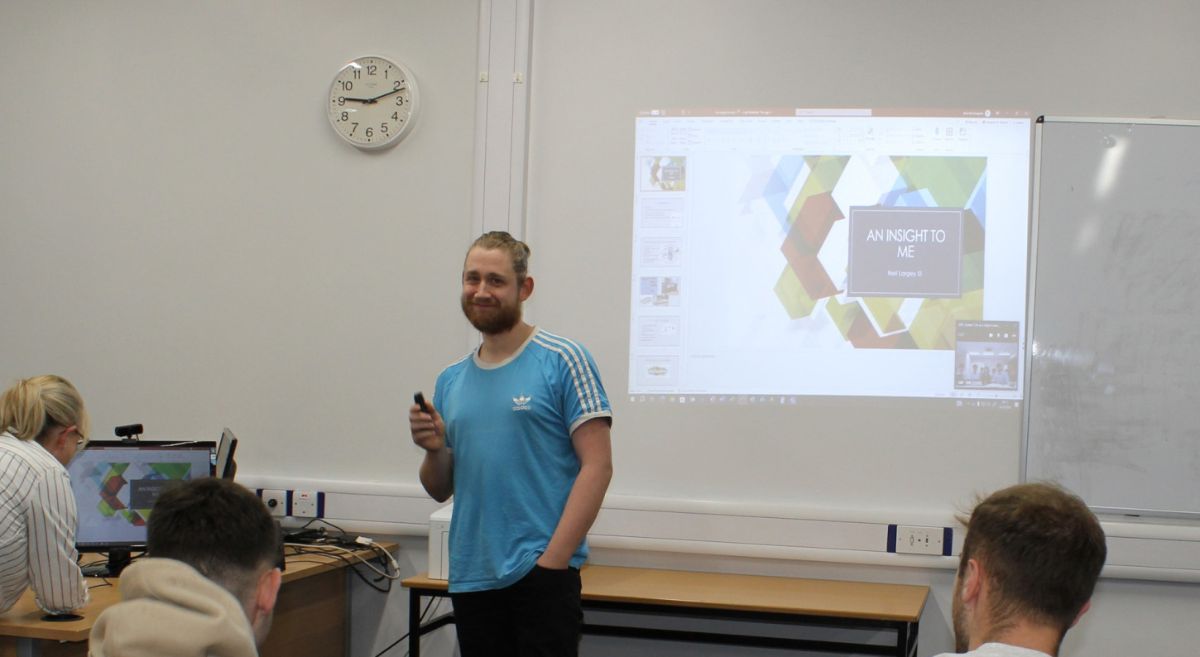 Picture of SERC Mechatronics student giving a presentation to his class. 