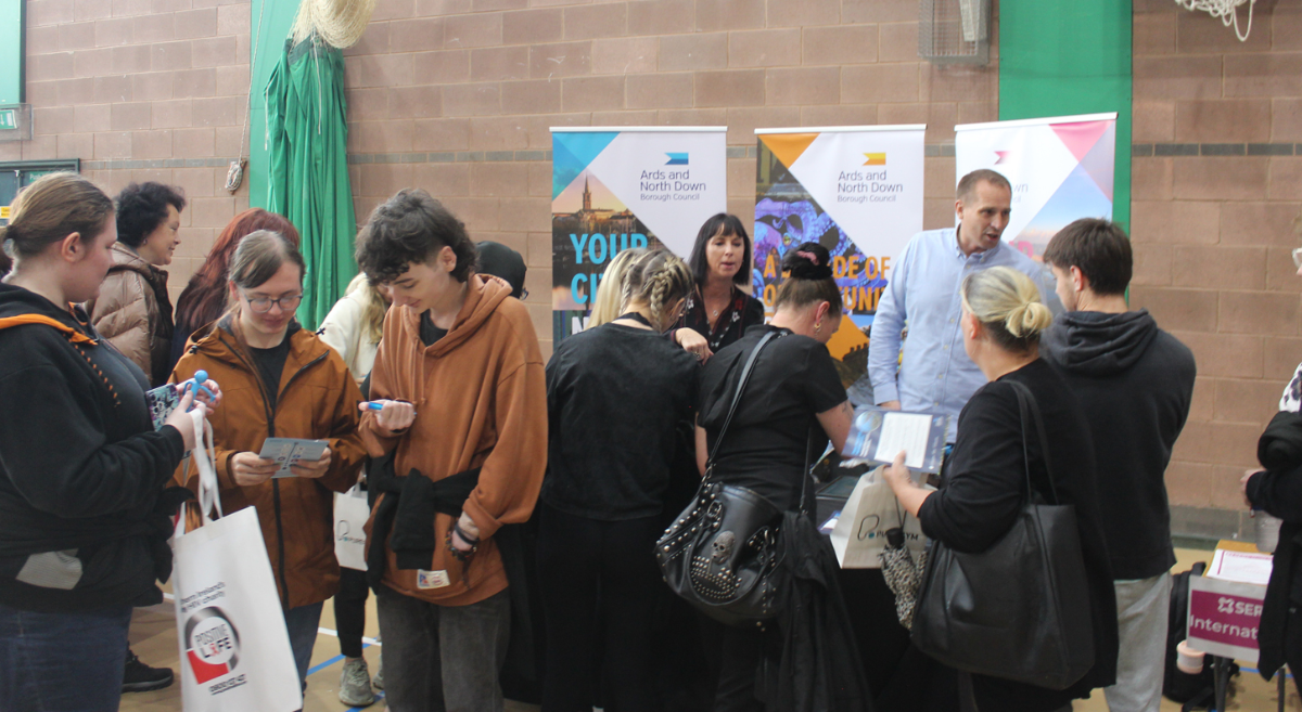 students standing beside a stall