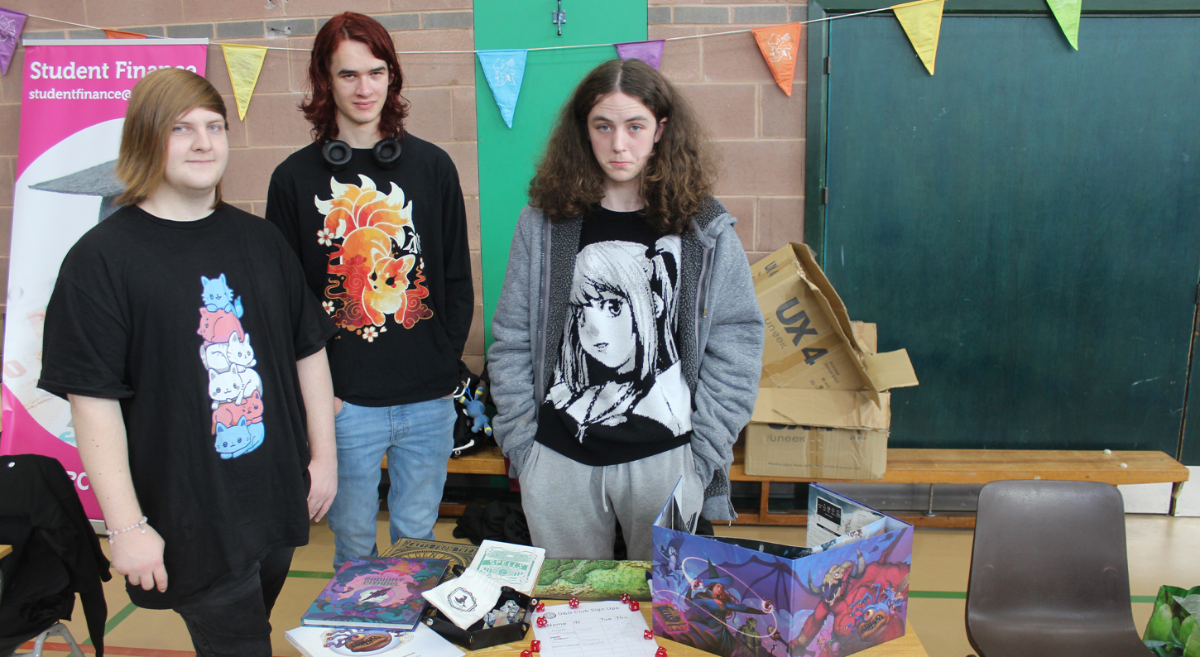 Students standing behind their stall