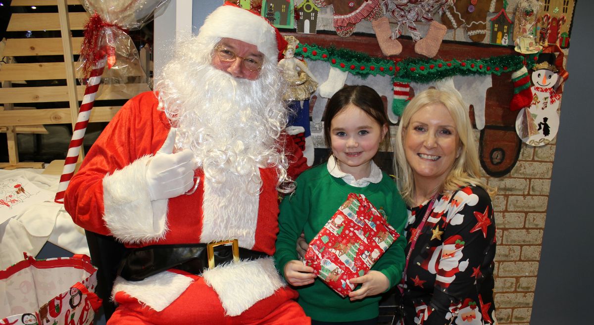 Pat Crane with grandchild Reeva and Santa