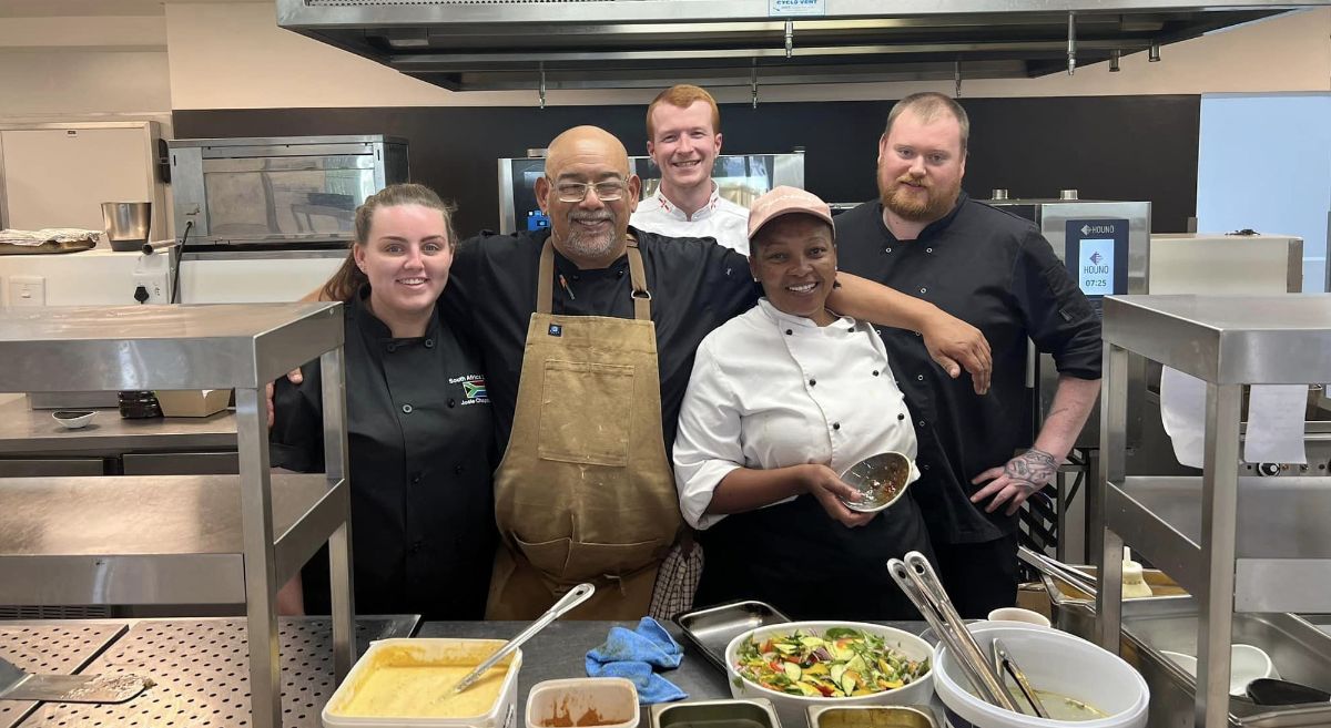 SERC students Josie Chapman, Matthew McGivern and David Rea with (front) Chefs from the De Zalze Golf Resort 