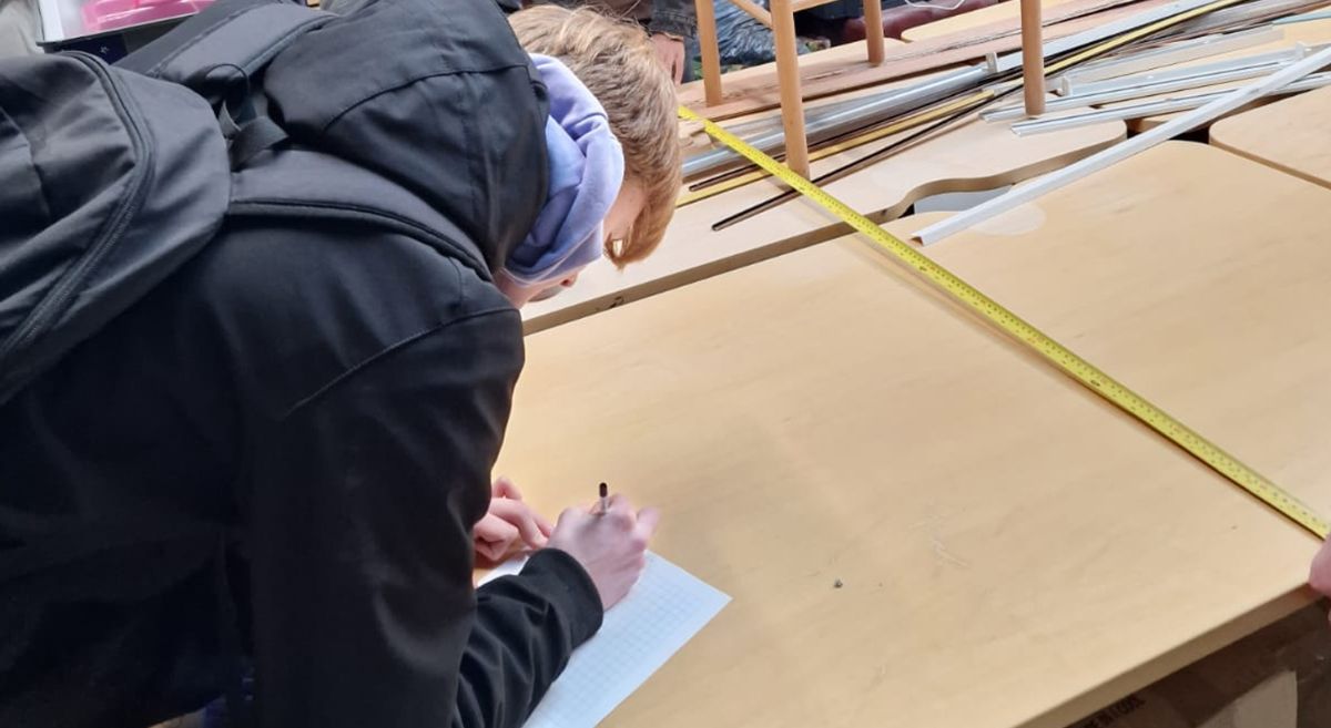 Picture of students working on setting up a computer suite