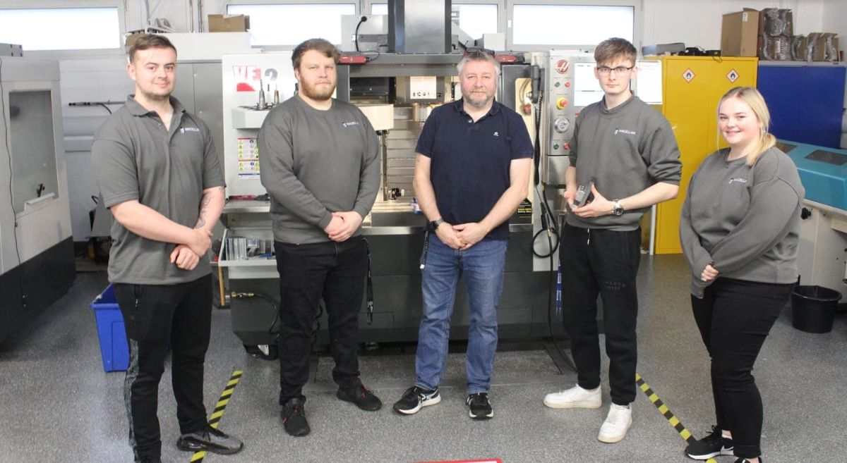 SERC Staff and Students beside a cnc machine