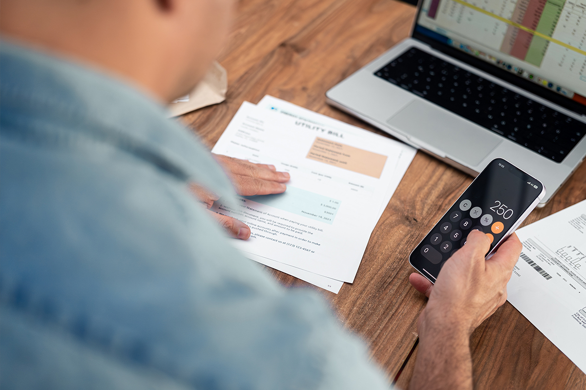 Photograph showing a man budget tracking